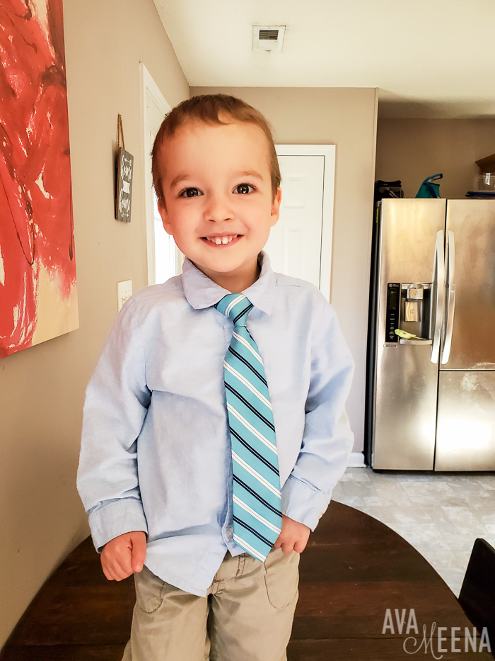 Little man wearing a blue shirt.